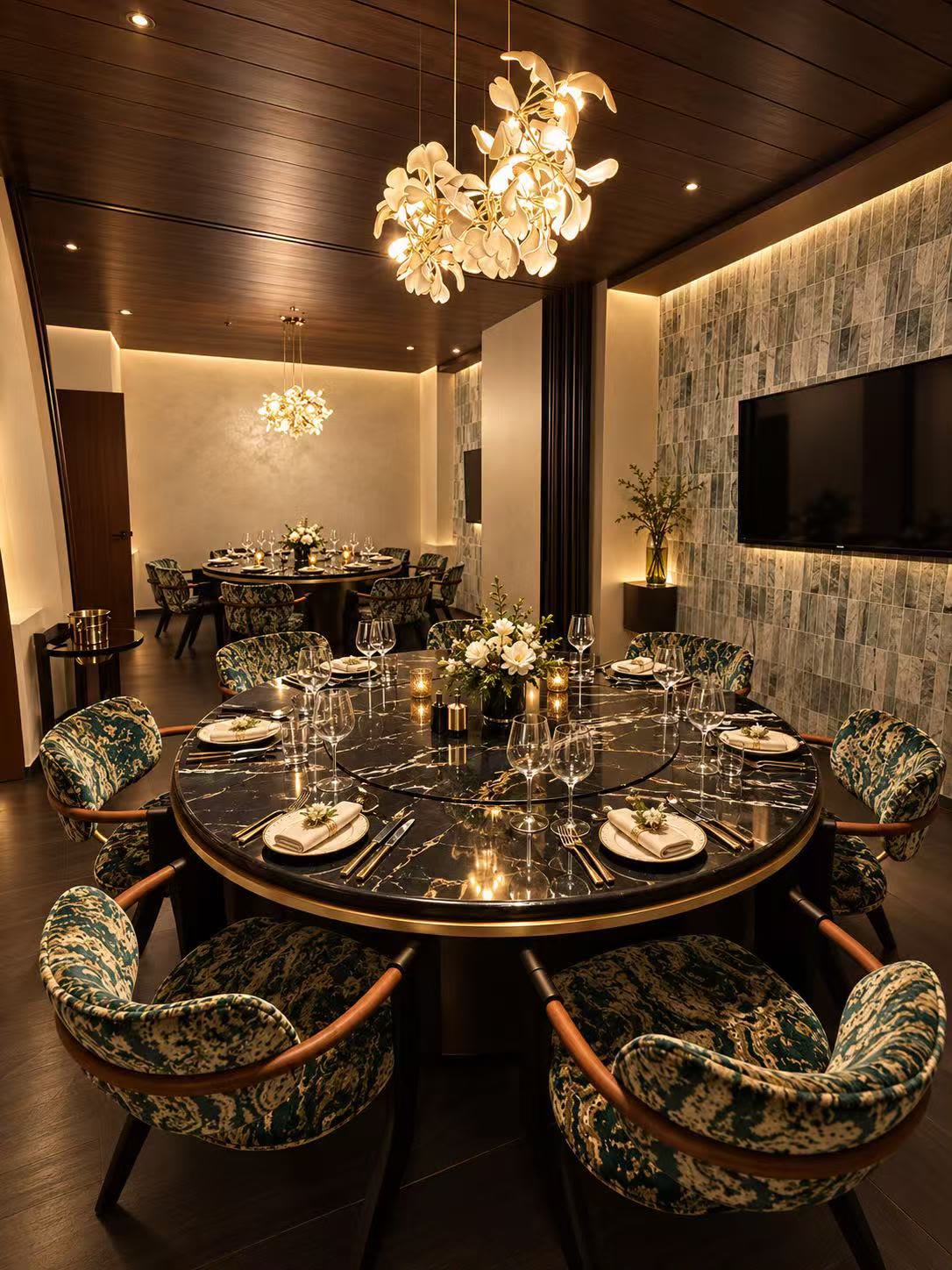 Private dining room at SHAO Dempsey with a round marble table and decorative wall finishes